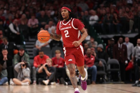 Boogie Fland #2 of the Arkansas Razorbacks brings the ball up court during the first half against the Baylor Bears at American Airlines Center on November 09, 2024 in Dallas, Texas.