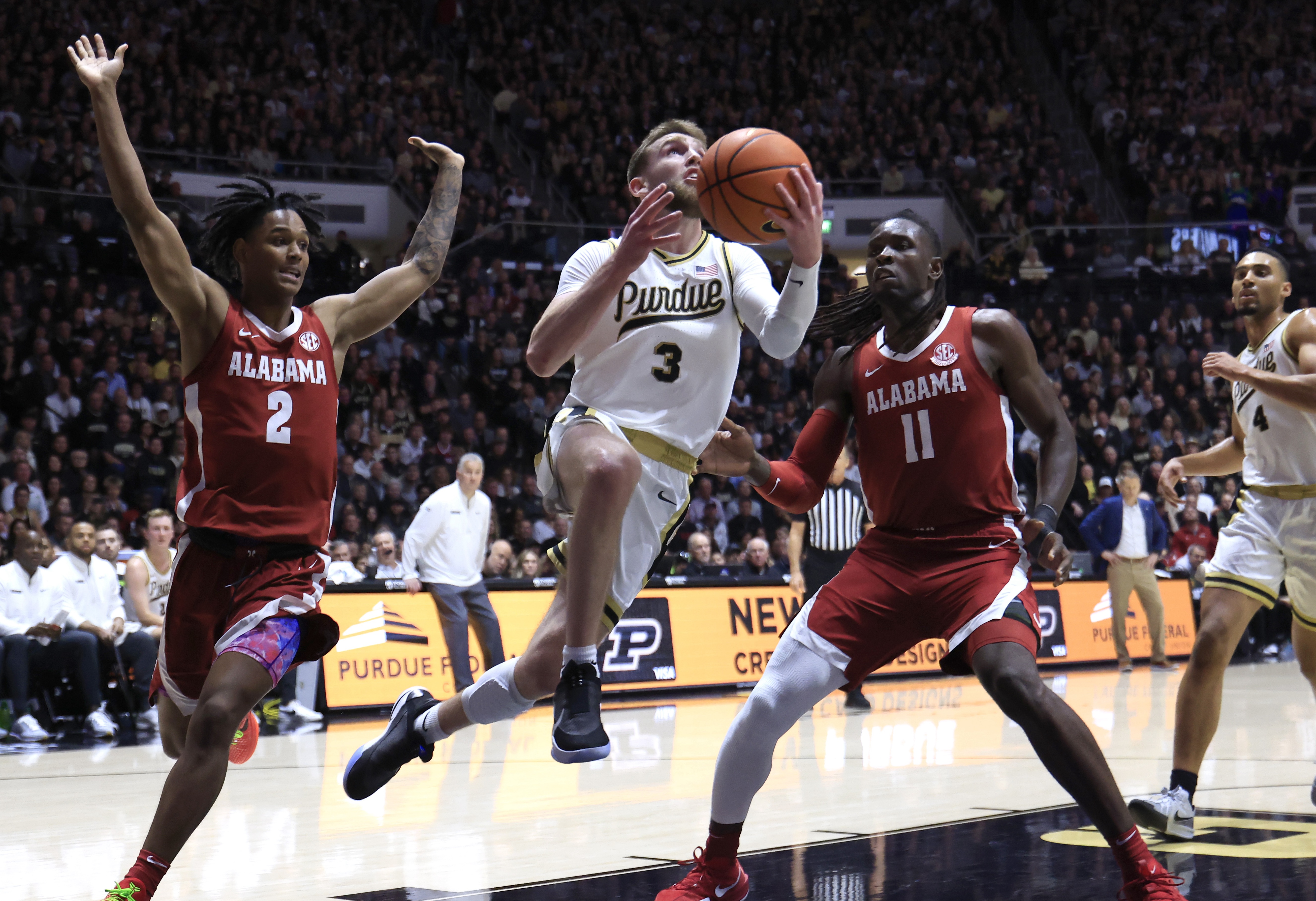 Purdue basketball player Braden Smith drives to the hoop versus the Alabama Crimson Tide.