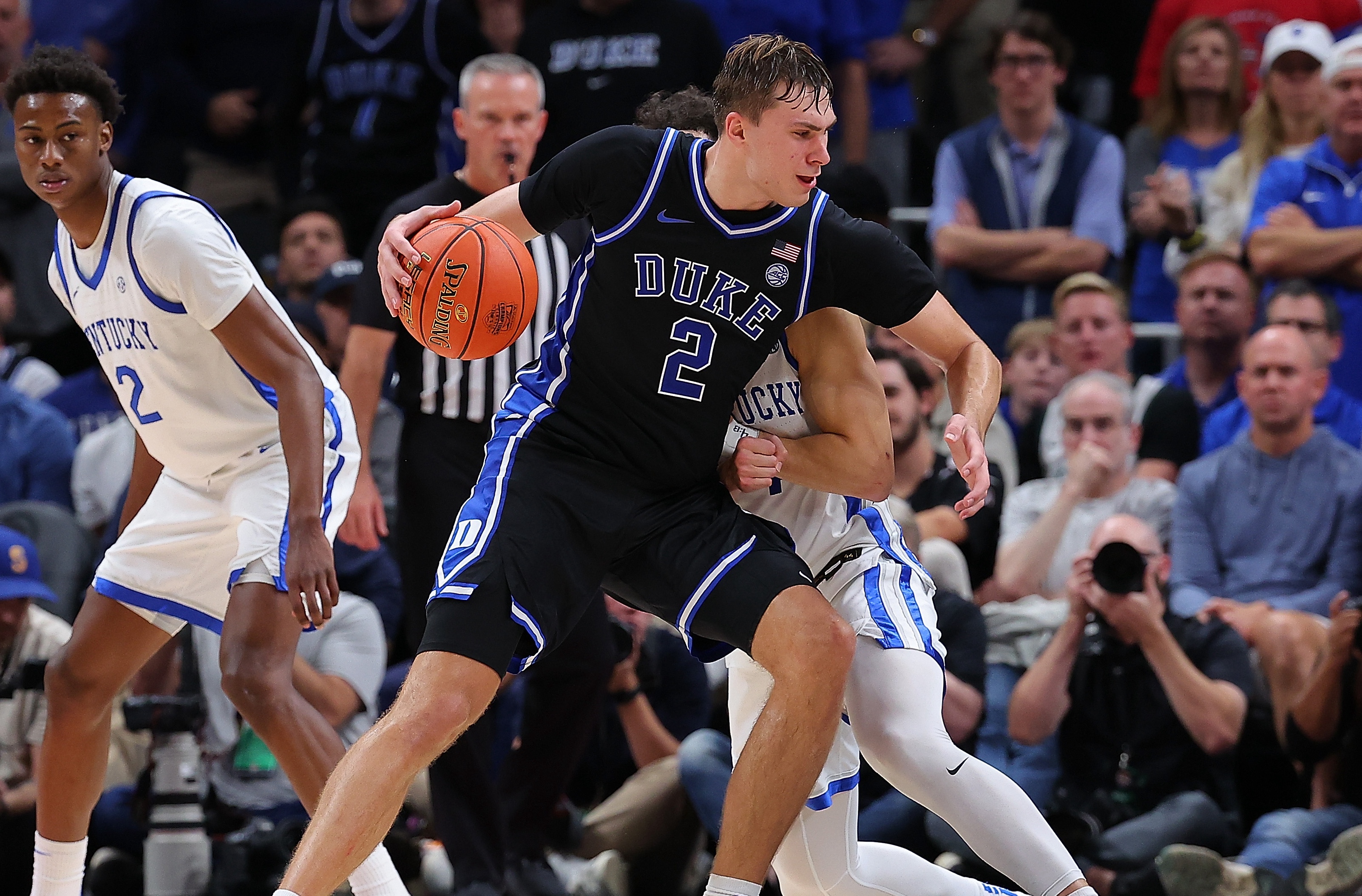 Cooper Flagg #2 of the Duke Blue Devils drives against Koby Brea #4 of the Kentucky Wildcats during the second half of the State Farm Champions Classic between the Kentucky Wildcats and Duke Blue Devils at State Farm Arena on November 12, 2024 in Atlanta, Georgia.