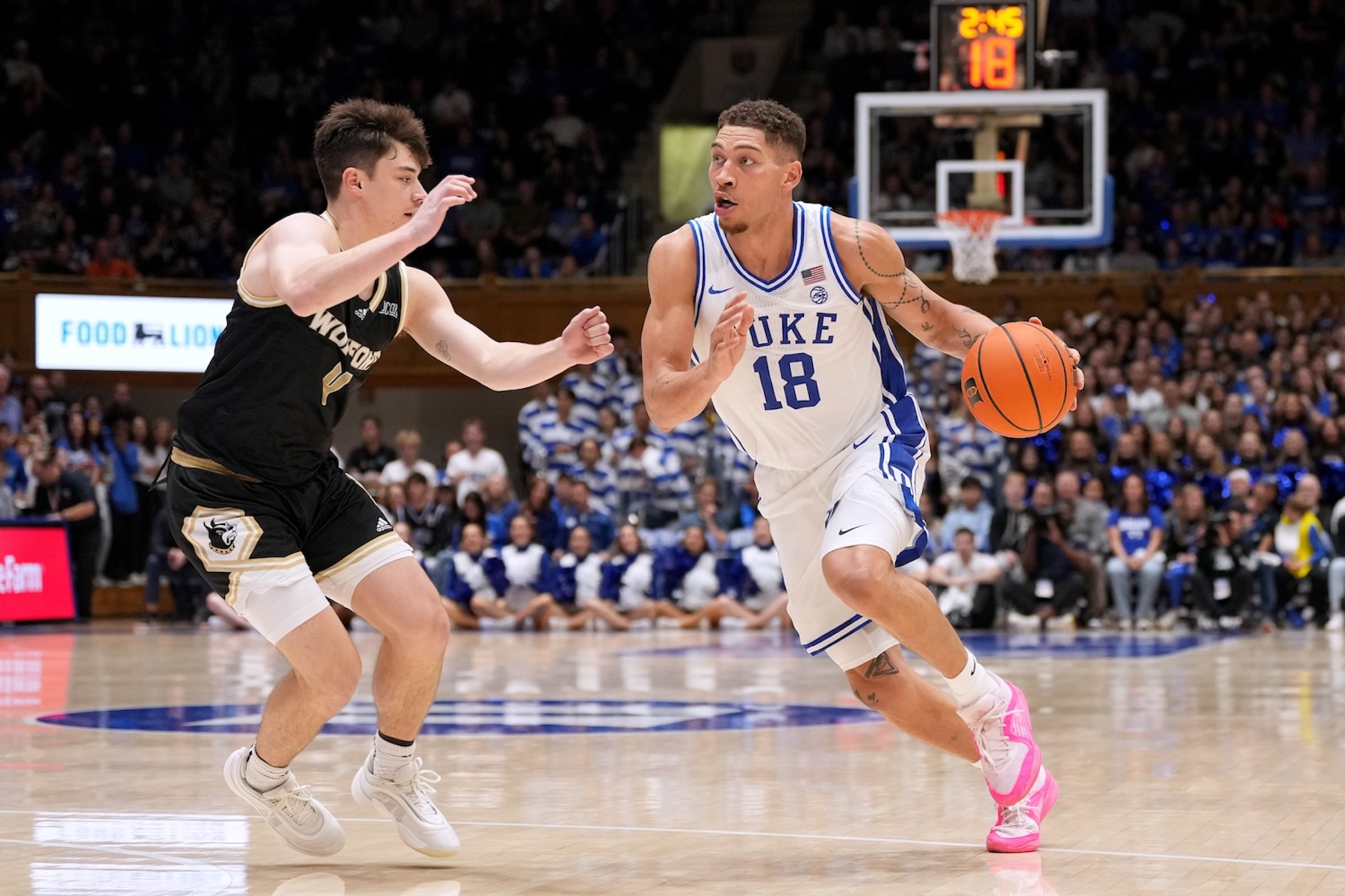 Mason Gillis #18 of the Duke Blue Devils moves the ball against Luke Flynn #4 of the Wofford Terriers