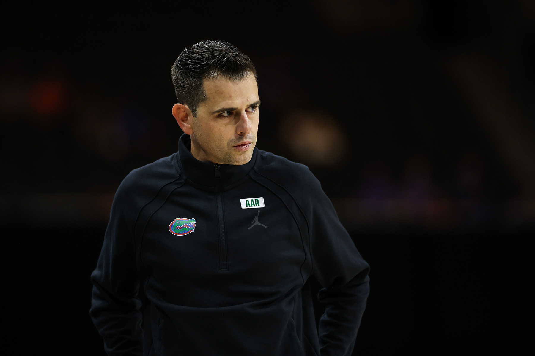 University of Florida head coach Todd Golden standing with a serious expression on his face