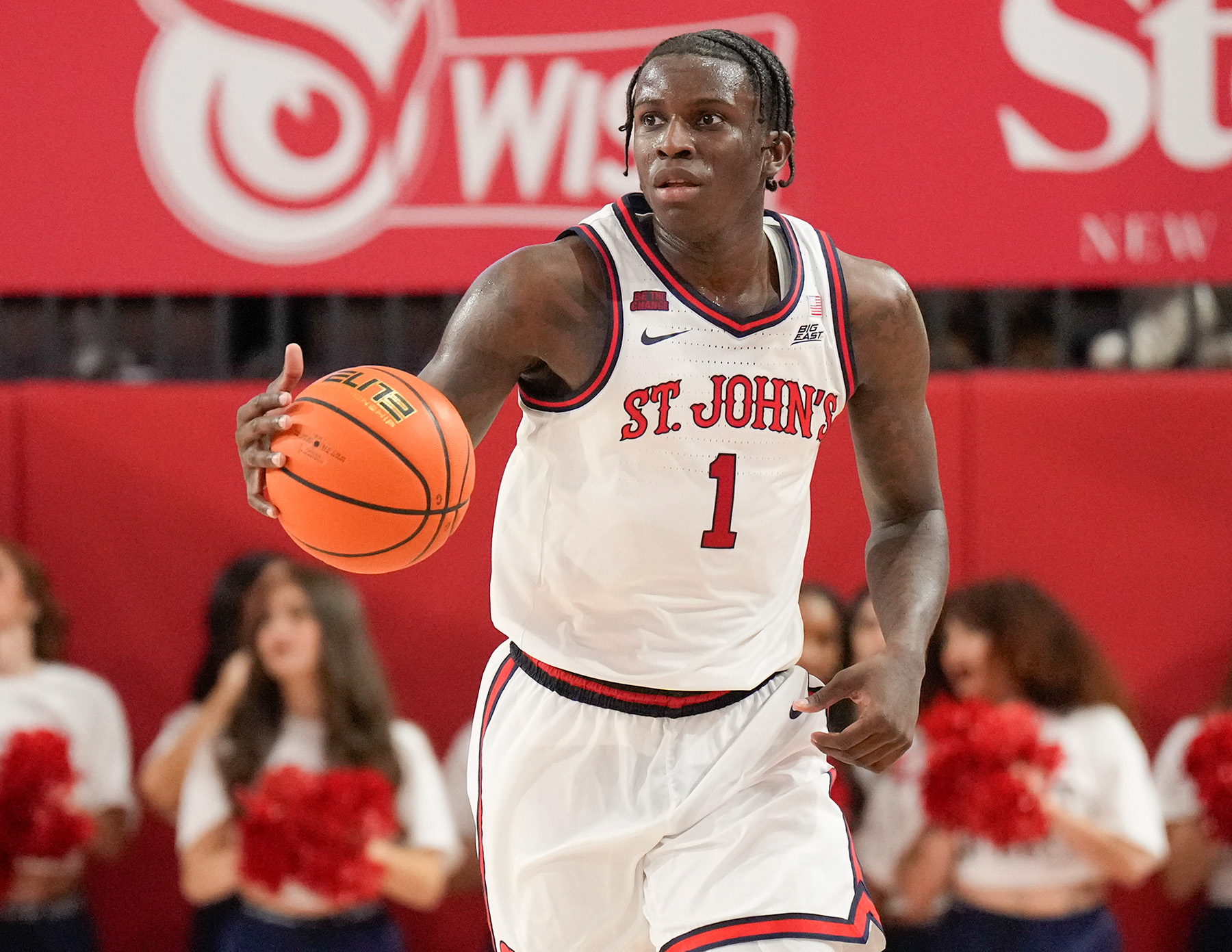 St. John's guard Kadary Richmond holds the ball in his right hand about to dribble.