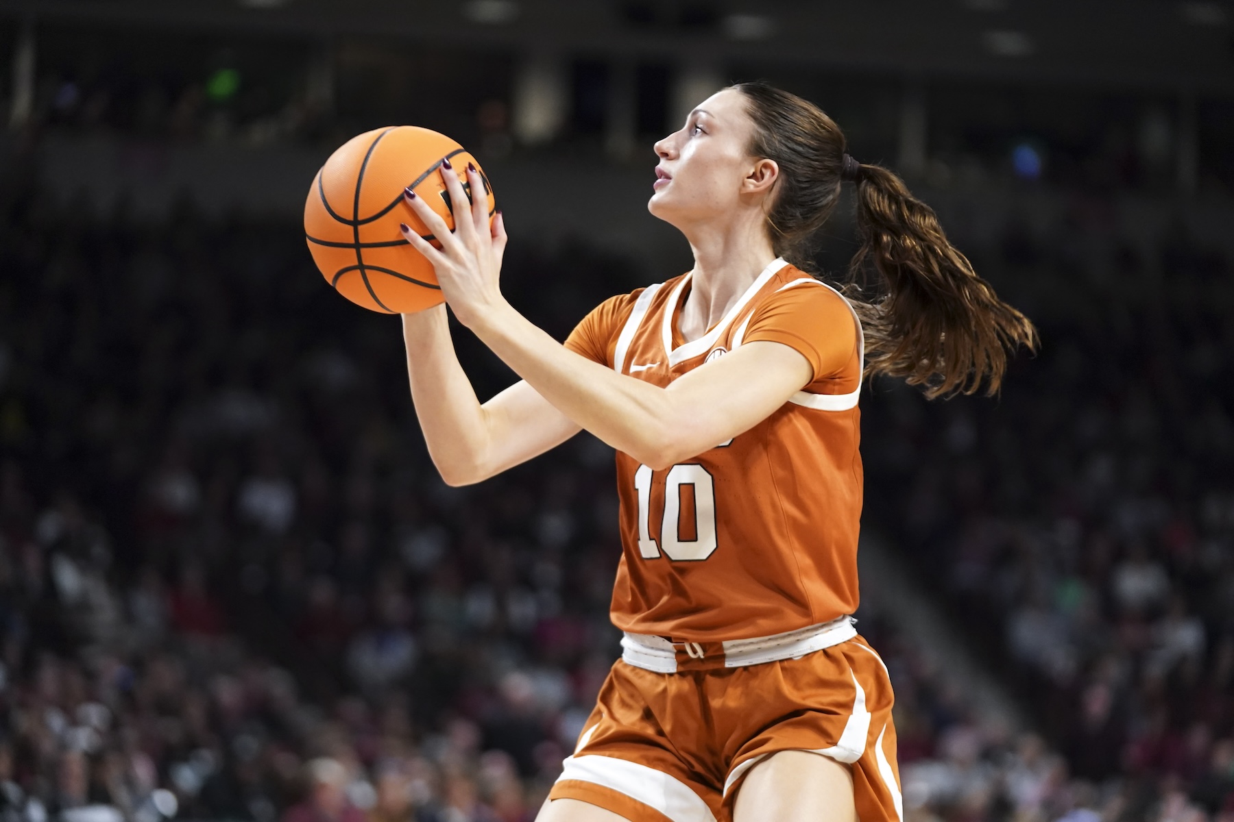 Shay Holle #10 of the Texas Longhorns shoots the ball