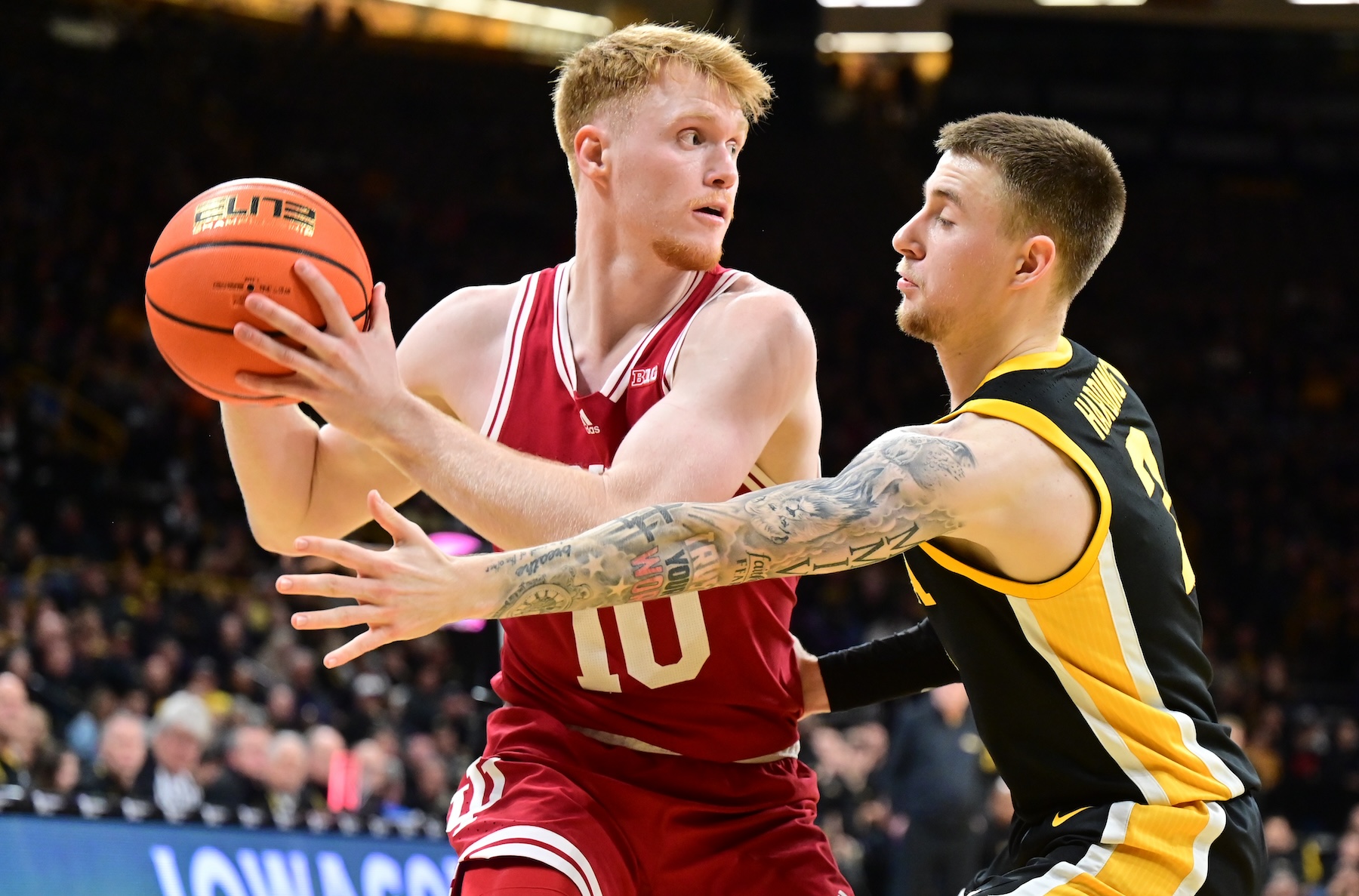 Iowa guard Brock Harding (2) reaches in to get the ball from Indiana forward Luke Goode