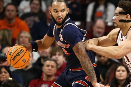 Johni Broome of the Auburn Tigers men's basketball team posts up an opponent