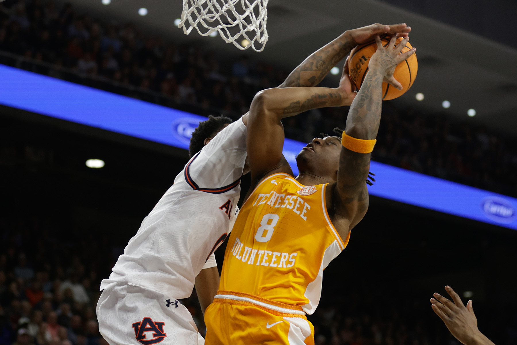 Tennessee's Darlinstone Dubar has his shot blocked by an Auburn player.