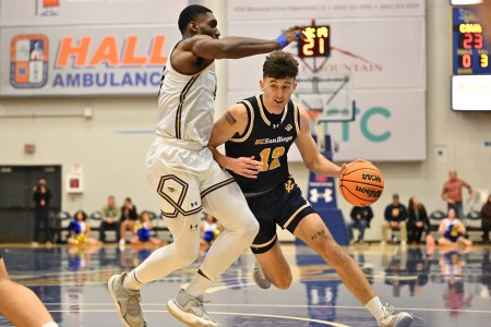 UC San Diego Tritons guard Aniwaniwa Tait-Jones drives the ball